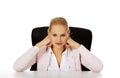 Happy business woman sitting behind the desk Royalty Free Stock Photo