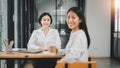 Happy business woman smiling face and happiness while discussing data in the office