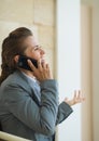 Happy business woman speaking mobile phone Royalty Free Stock Photo