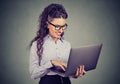 Happy business woman standing using laptop computer Royalty Free Stock Photo