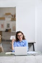 Happy business woman or student working on laptop pointing up having idea. Royalty Free Stock Photo