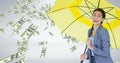 Happy business woman under umbrella with money rain against grey background