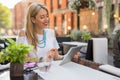 Happy business woman using tablet