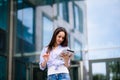 Happy business woman using tablet pc in front of office building Royalty Free Stock Photo