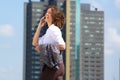 Happy business woman walking and talking on cell phone Royalty Free Stock Photo