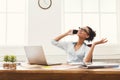 Happy business woman at work talking on phone Royalty Free Stock Photo