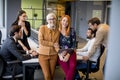 Happy business women working together online on a digital tablet at the office Royalty Free Stock Photo