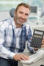 happy businessma showing calculator Royalty Free Stock Photo