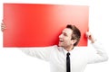 Happy businessman with blank red billboard Royalty Free Stock Photo