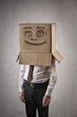 Happy businessman with a box on his head Royalty Free Stock Photo