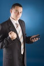 Happy businessman with calculator in his hand Royalty Free Stock Photo