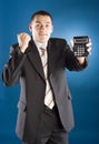 Happy businessman with calculator in his hand Royalty Free Stock Photo