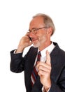 Happy businessman on cell phone. Royalty Free Stock Photo