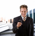 Happy businessman with cellphone Royalty Free Stock Photo