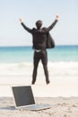 Happy businessman cheering in front of the sea Royalty Free Stock Photo