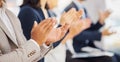 Happy businessman clapping hands for presentation during a meeting in an office boardroom with colleagues. Diverse group Royalty Free Stock Photo