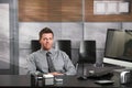 Happy businessman at desk Royalty Free Stock Photo
