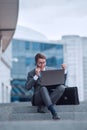 Happy businessman discussing good news on his smartphone Royalty Free Stock Photo