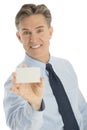 Happy Businessman Displaying Blank Business Card Royalty Free Stock Photo