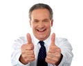 Happy businessman gesturing double thumbs-up Royalty Free Stock Photo