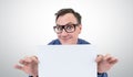 Happy businessman in glasses holding a white sheet of paper Royalty Free Stock Photo