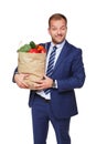 Happy businessman hold bag with healthy food, grocery buyer isolated Royalty Free Stock Photo