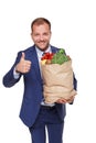 Happy businessman hold bag with healthy food, grocery buyer isolated Royalty Free Stock Photo