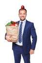 Happy businessman hold bag with healthy food, grocery buyer isolated Royalty Free Stock Photo