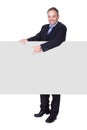 Happy Businessman Holding Blank Billboard Royalty Free Stock Photo