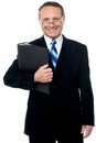 Happy businessman holding files Royalty Free Stock Photo