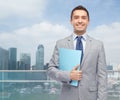 Happy businessman holding folder Royalty Free Stock Photo