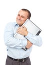 Happy businessman holding his laptop Royalty Free Stock Photo