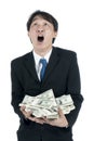 Happy businessman holding a lot of US Dollars in his hand Royalty Free Stock Photo