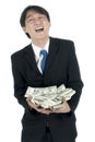 Happy businessman holding a lot of US Dollars in his hand Royalty Free Stock Photo