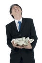 Happy businessman holding a lot of US Dollars in his hand Royalty Free Stock Photo