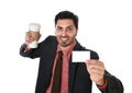 Happy businessman holding take away coffee cup and white card in blank as copy space Royalty Free Stock Photo