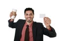 Happy businessman holding take away coffee cup and white card in blank as copy space Royalty Free Stock Photo