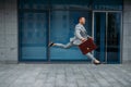 Happy businessman jumping at the office building Royalty Free Stock Photo