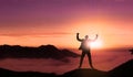 Happy Businessman Jumping On The Top of Mountain Sunset .Successful Man Jumps for Joy with Beautiful Landscape Background. Royalty Free Stock Photo