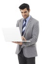 Happy businessman with laptop computer Royalty Free Stock Photo