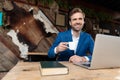 Happy businessman laughing and holding a cup of coffee Royalty Free Stock Photo