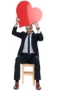 Happy businessman laughing and holding heart shape above his head Royalty Free Stock Photo