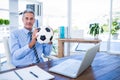 Happy businessman looking at camera and holding foot ball Royalty Free Stock Photo