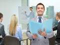 Happy businessman with open folder Royalty Free Stock Photo