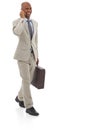 Happy businessman, phone call and walking with suitcase for discussion on a white studio background. Black man or Royalty Free Stock Photo