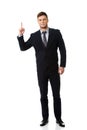Happy businessman points his finger up. Royalty Free Stock Photo