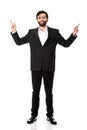 Happy businessman points his finger up. Royalty Free Stock Photo