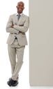 Happy businessman, portrait or leaning on wall in confidence with arms crossed on a white studio background. Young black Royalty Free Stock Photo