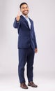 Happy businessman, portrait and thumbs up for approval, success or winning against a white studio background. Asian man