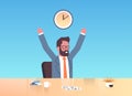 Happy businessman raising hands expressing success effective time management concept cheerful business man sitting